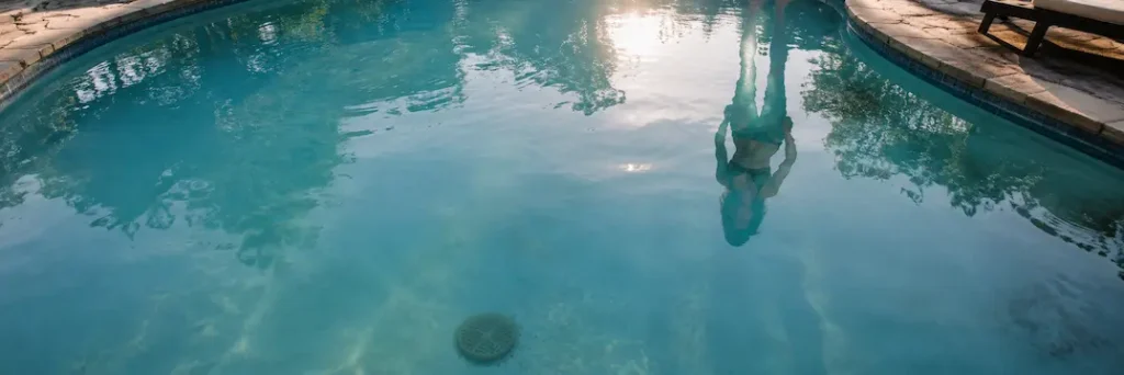 Slightly Cloudy Pool Water On A Sunny Day, A Sign That Aging Filtration May Not Be Keeping The Water Clean.